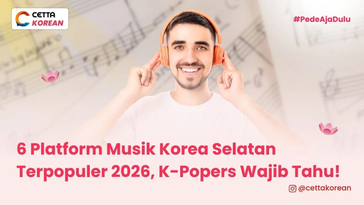 Seorang pria menggunakan headphone orange mendengarkan musik korea melalui salah satu platform musik korea selatan populer 2026