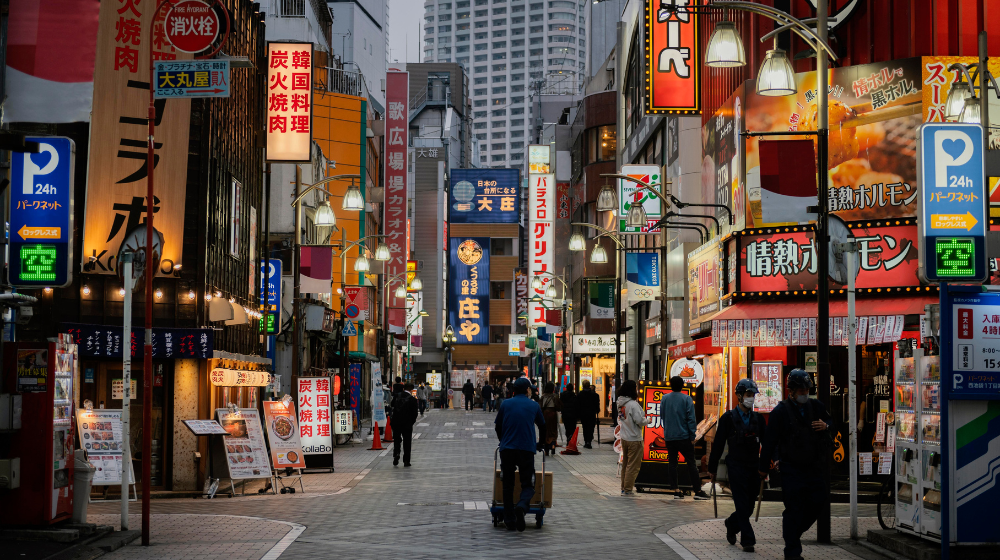 Freepick Assets "Free photo people walking on japan street at nighttime"