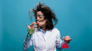 Freepik "Free photo wacky chemistry expert with messy hair and dirty face smelling glass flask filled" by DCStudio