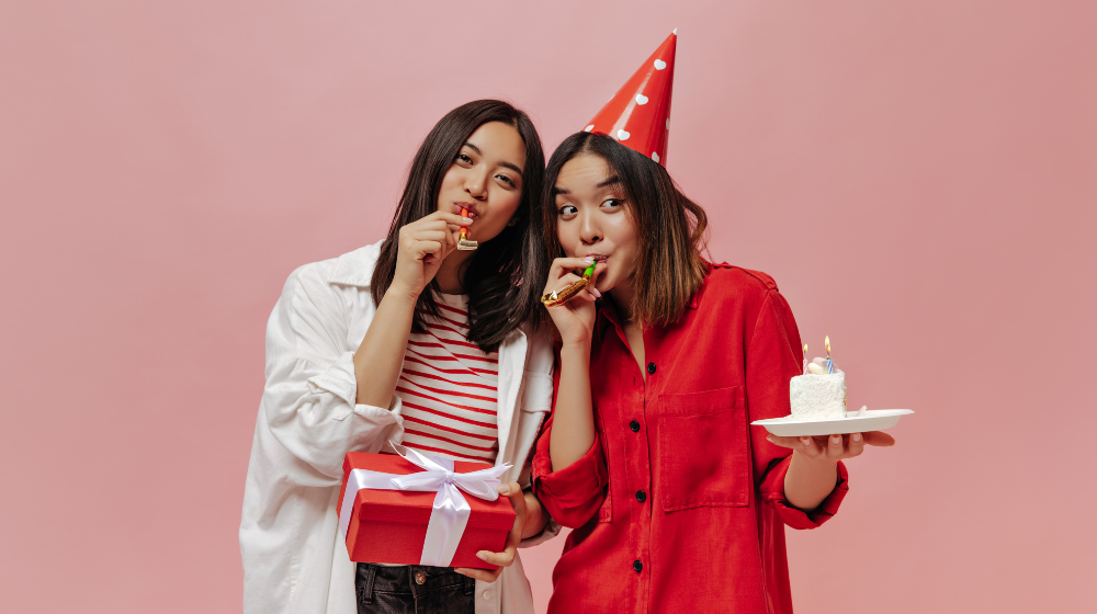 Freepik "Short-haired women celebrate birthday on pink isolated wall" by lookstudio