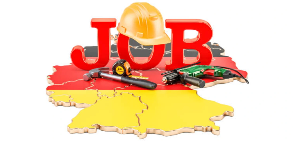 Gambar tulisan Job, dengan alat-alat pertukangan di atas gambar wilayah Jerman yang diwarnai sesuai dengan warna bendera Jerman