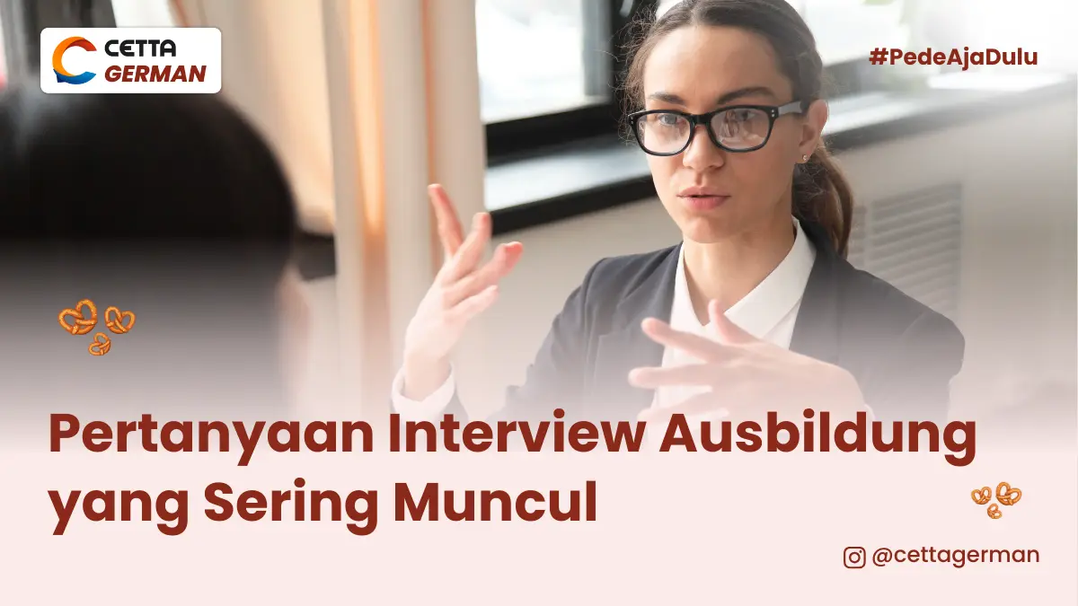 seorang perempuan terlihat sedang menginterview orang di depannya dengan gestur tangan melambai di udara