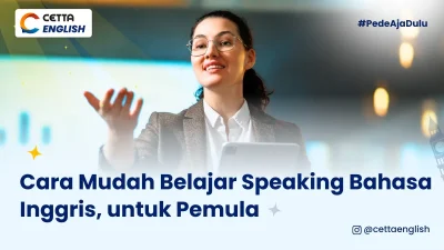 Seorang perempuan yang sedadng berbicara di atas penggung mengenakan sebuah setelan jaz