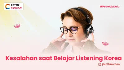 Seorang wanita sedang melakukan listening Bahasa Korea
