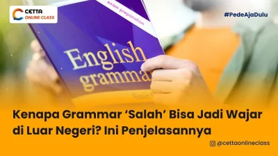 seseorang sedang memegang buku grammar